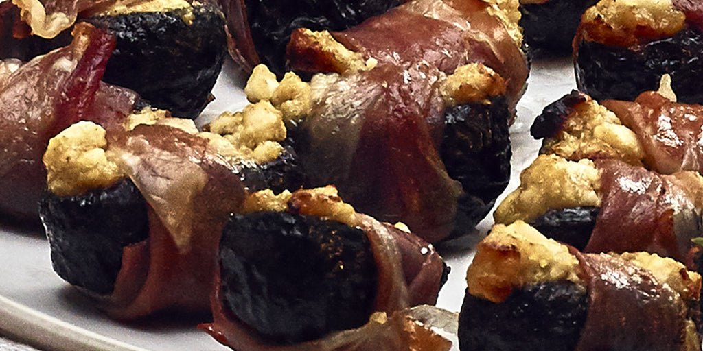 Prunes stuffed with Goats Cheese and wrapped in Bacon or Parma Ham